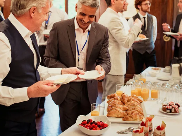 Men chatting at breakfast