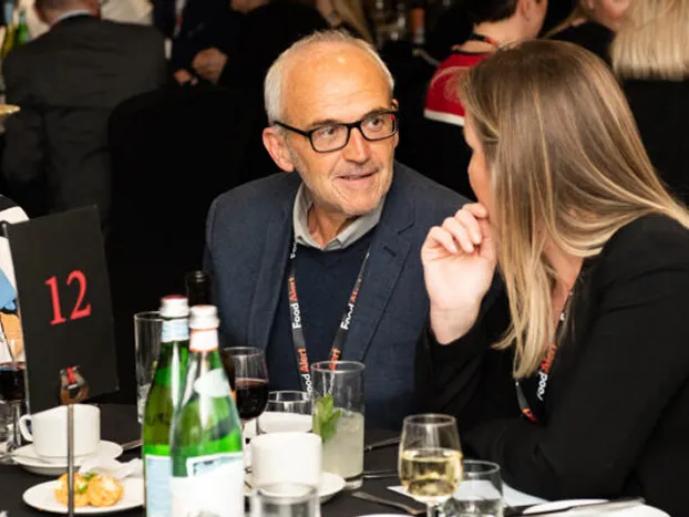 Man and women chatting at event